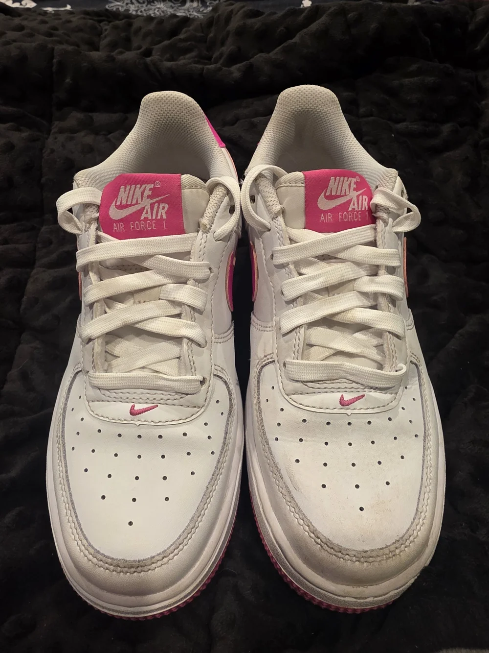 Nike Air Force 1 White Low-Top with Bright Pink Swoosh and Outsole.